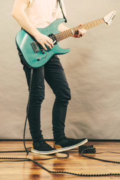 Man playing on electric guitar