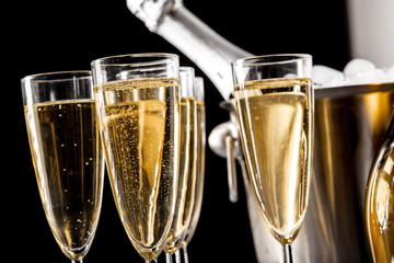 glasses of champagne with a champagne bottle in a bucket