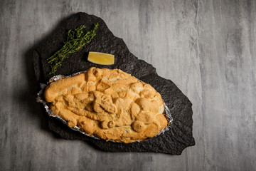 top view on baked dorado under egg whites