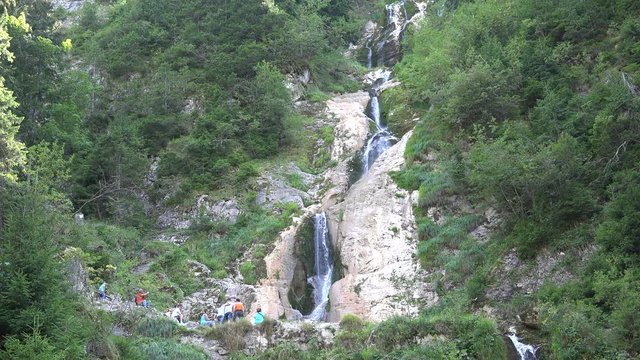 Tourists Visiting Water Fall Brook in Mountains, Waterfall in Maramures