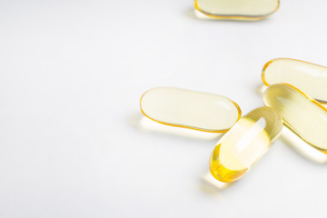 The fish oil capsule close up image on white background.