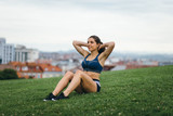 Female athlete doing sit ups