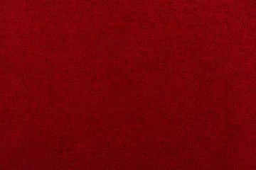 Knitted background. Knitted red texture. A knitting pattern of wool. Knitting. Background.