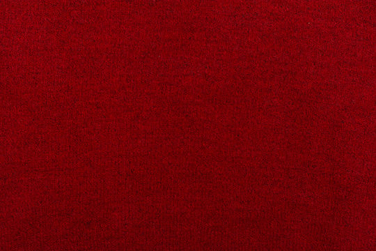 Knitted background. Knitted red texture. A knitting pattern of wool. Knitting. Background.