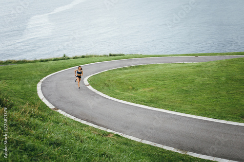 Female athlete running at the park