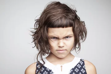 Little angry girl with stylish haircut © Radarani