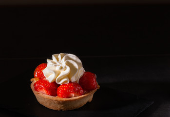 sweet homemade strawberry tart isolated on a black background