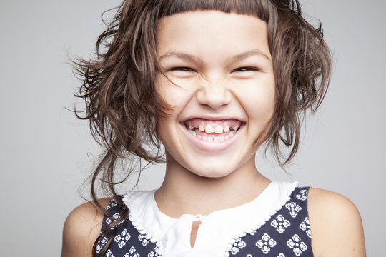 Portrait Of A Girl With A Stylish Hairstyle With A Short Bangs And Nice Smile