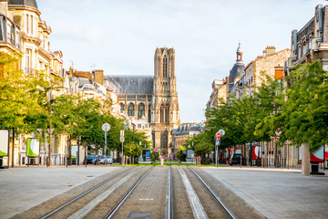 Street view with cathedral in Reims city, France - obrazy, fototapety, plakaty