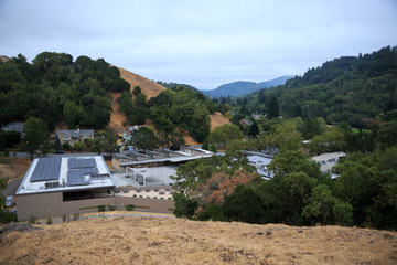 Public junior high school with solar panels on roof in Northern California hills