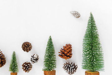 Christmas and New year background. Christmas tree and pine cones on white paper. Crative flat lay , top view design