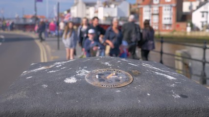 A rubbish bin fire starting due to an inadequately extinguished cigarette.