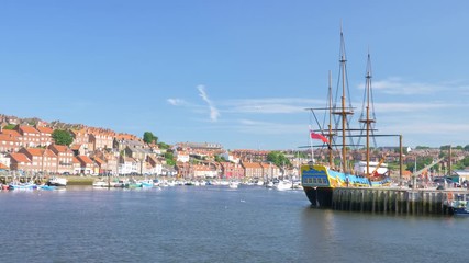 Pirate galleon ship within Whitby harbour on a sunny afternoon.