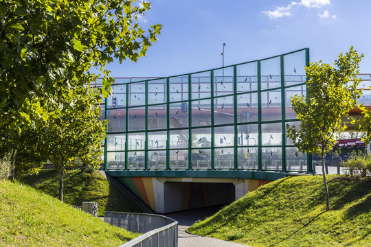 Sound absorbing screens along the highway and bike paths.Metal frames filled with glass.Figure black birds on the glass.Modern technology in Poland.