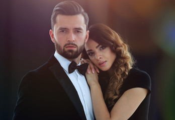 Elegant couple passing in classic clothes.