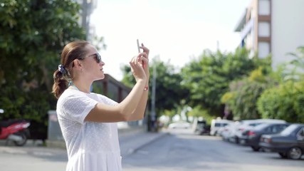 Tourist Photographing Using Phone in Vacation Travel. Woman taking pictures with smartphone enjoying holidays travel.