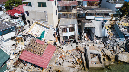 The destroyed house after the earthquake on the seashore