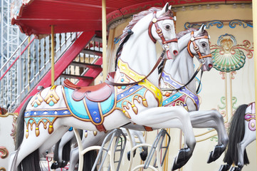 Horses carousel attraction. Festival holiday.