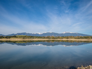 The lake with clear turquoise water is surrounded by mountains. Liptovska Mara Slovakia. The concept of ecological and active tourism. Autumn in nature.