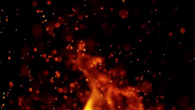 Super slow motion of fire sparks isolated on black background. Filmed on high speed camera, 1000 fps