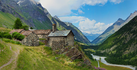 alpine old architecture with mountain river in Rhemes, Notre Dame - Powered by Adobe