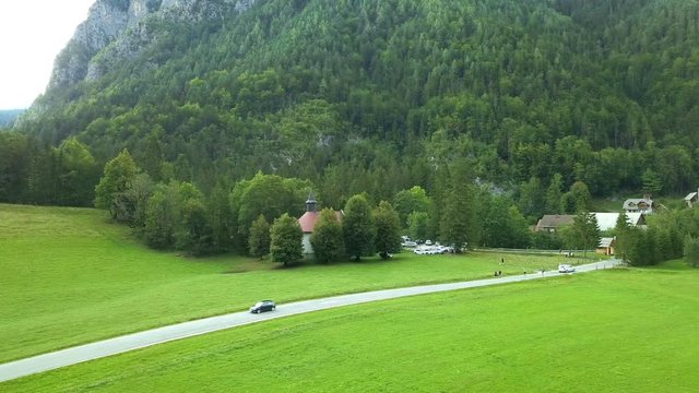 Aerial: Filming entrance in to beautiful green mountain valley in Slovenia. Filmed on trip in Logarska dolina valley in Slovenia.