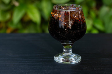 Soft drink mix Ice in glass isolate on table 
