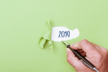 2019 year revealed by ripped piece of paper