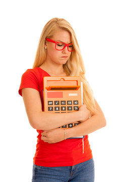Shocked young student in red t shirt with calculator isolated over white