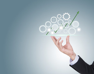 Investing in growth financial business concept as hands holding a finance pie chart and arrow made of machine gears and cog wheels as a symbol supporting technology with growth potential.