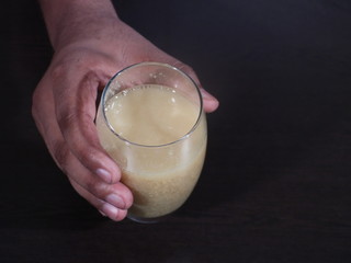 Fenugreek Seeds or Methi Dana drink by soaking it in water overnight. helpful in weight loss, digestion and blood sugar treatment, Methi Dana Drink in Glass on Wooden Background