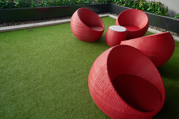 relax zone with red wheats seat on grass floor