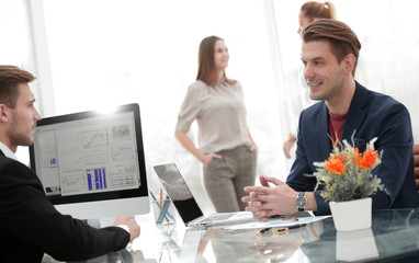 senior and junior businessman discuss something during their meeting