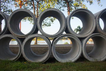 Concrete drainage pipes stacked on construction site, Can use background