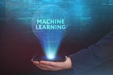 The concept of business, technology, the Internet and the network. A young entrepreneur working on a virtual screen of the future and sees the inscription: Machine learning