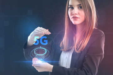 The concept of business, technology, the Internet and the network. A young entrepreneur working on a virtual screen of the future and sees the inscription: 5G