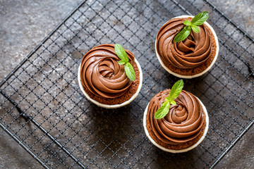 chocolate cupcake with chocolate cream in white capsules