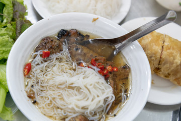 Bun Cha with grilled pork, rice noodles, vegetable and soup in vietnamese cuisine and street foods...