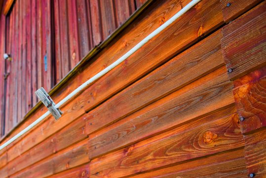 One clothespin against a wooden building
