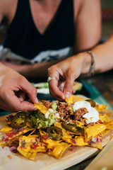 Couple eating street tacos and nachos at outdoor mexican restaurant. Mexican food. - 225899324
