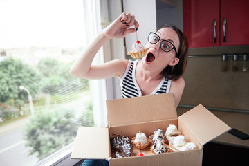 girl eating tasty cakes, sitting by the window, sweet food and pleasure