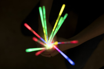 glow sticks in hands