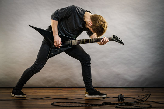 Man playing on electric guitar