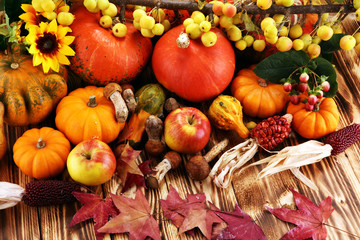 Autumn nature concept. Fall fruit and vegetables on wood. Thanksgiving dinner. Pears and pumpkin...