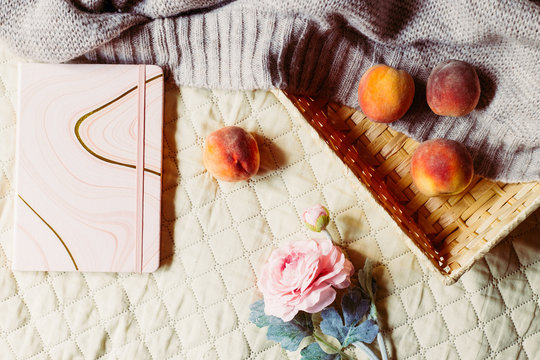 Basket with peach blossom and artificial flower