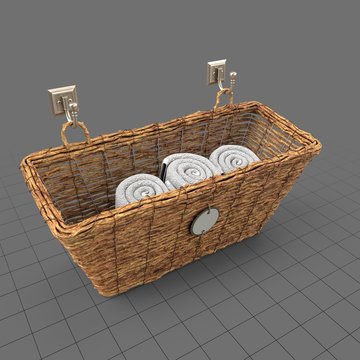 Woven storage basket with towels