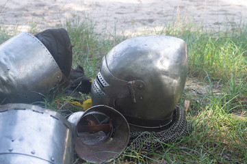Knight's helmet on the green grass day