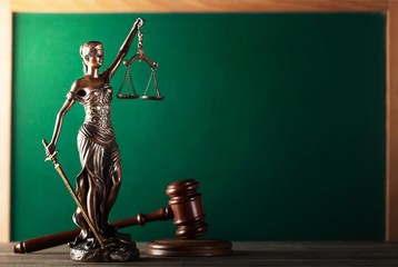 Law scales on table background. Symbol of