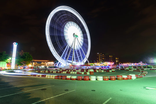 Ferris Wheel At Amusement Park In Night Time