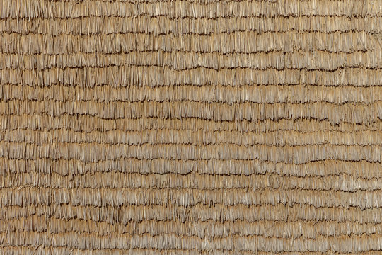 straw background for isolation of a wall at an old rural house
